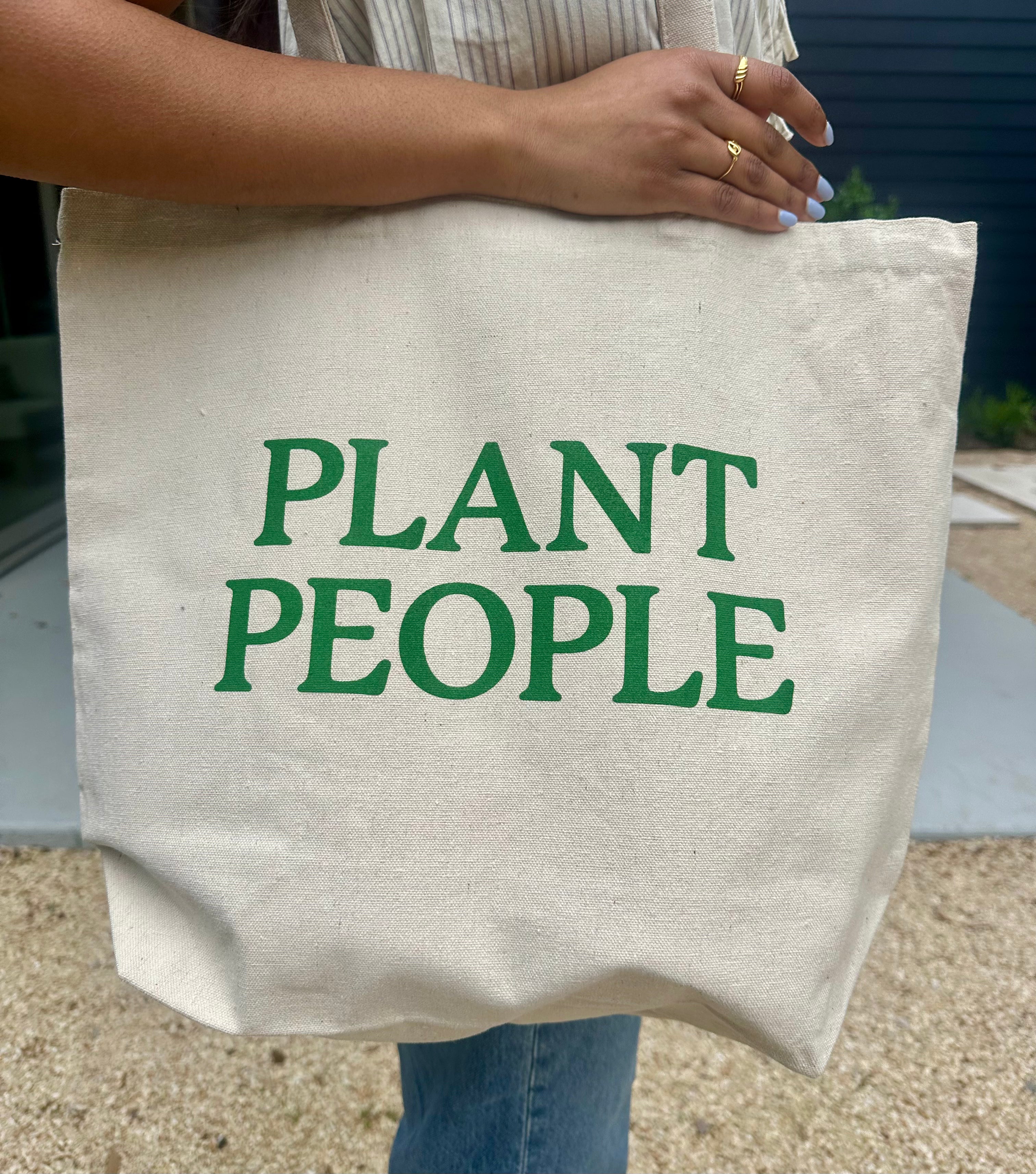 Lifestyle Image of Plant People Tote bag Side 2 on a person's shoulder