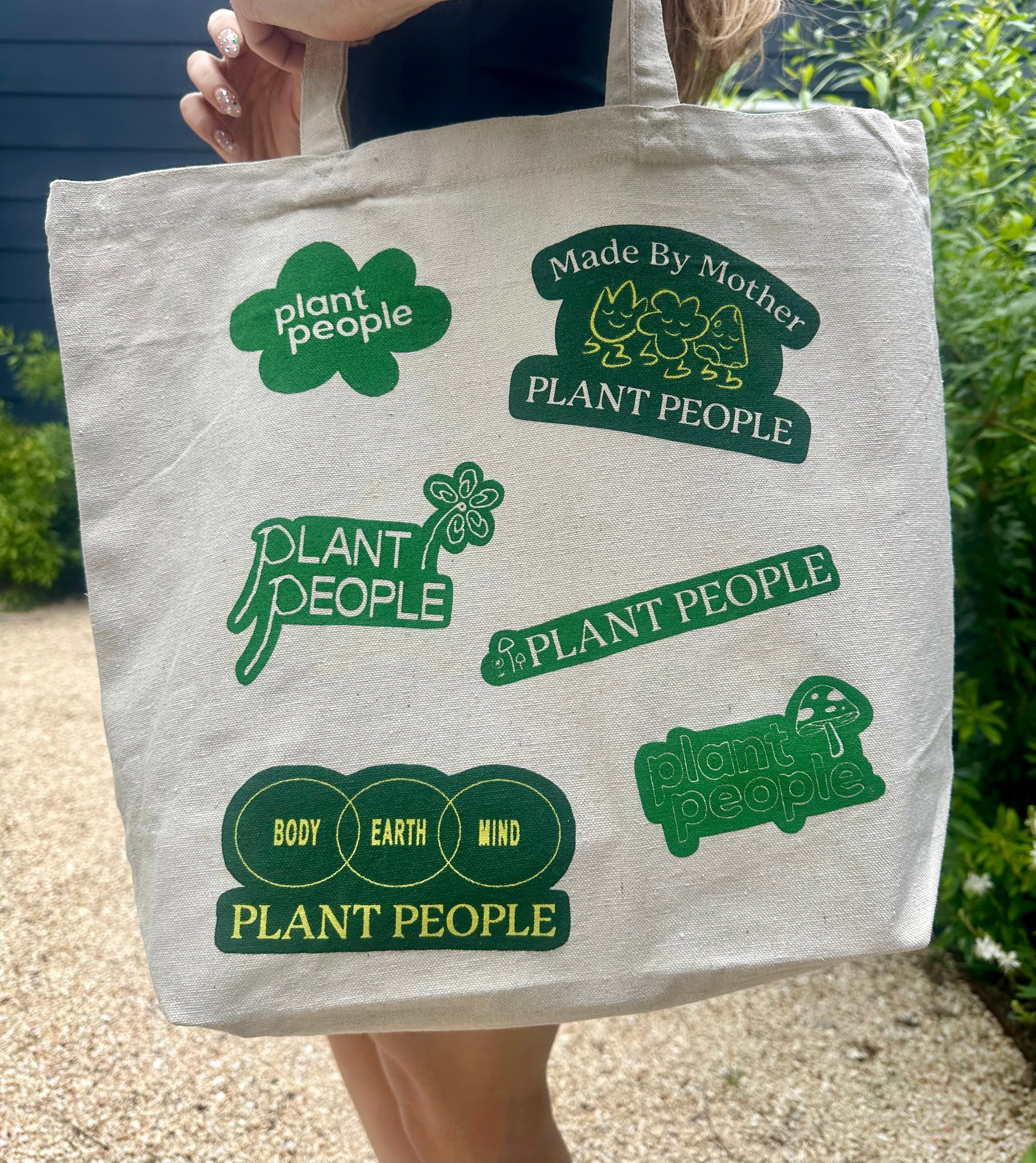 Lifestyle Image of Plant People Tote bag Side 1 on a person's shoulder