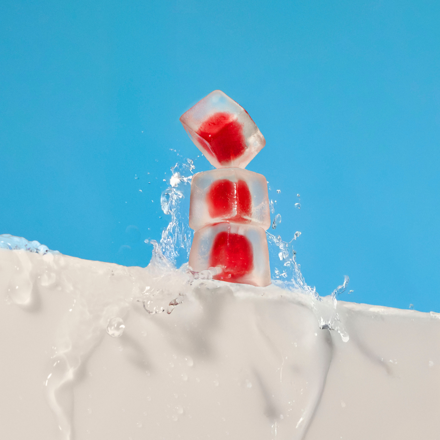 WonderHydrate Gummies Stacked up with water splashing