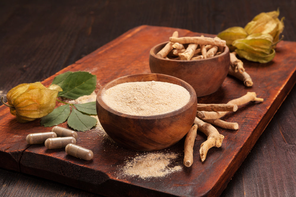 Roots and powder of Ashwagandha also known as Indian ginseng on wooden background