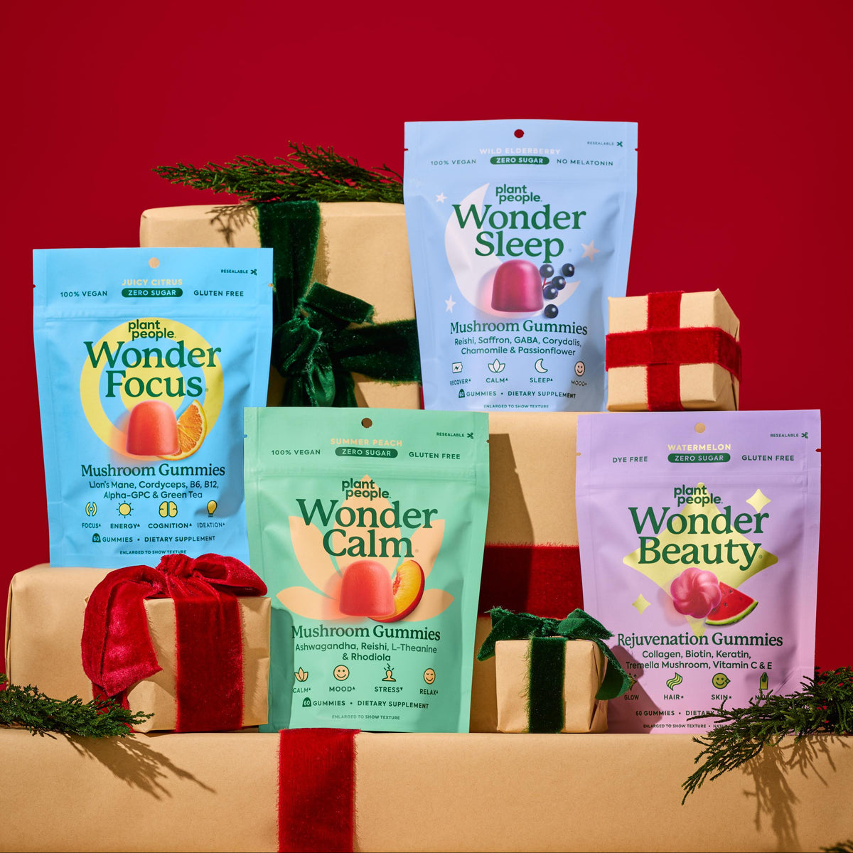 Assorted packages of 'Plant People' gummies on a red background with gift boxes and greenery.