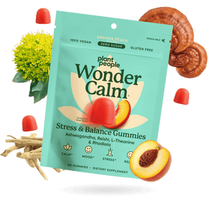 Plant People Wonder Calm Stress & Balance Gummies in a bright teal pouch, surrounded by peach slices, red gummies, a yellow flower, and mushroom slices on a white background.